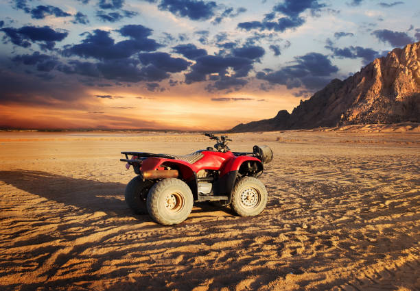 istock Quad bike in sand desert 878385838