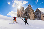 Side View of Two Young Male Skiers at Ski Touring in Dolomites