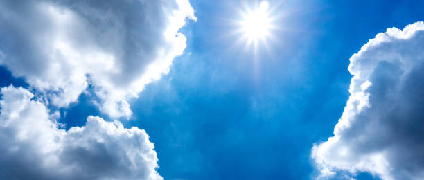 istock The sun is shinning in the blue sky and cumulus cloud 878390578