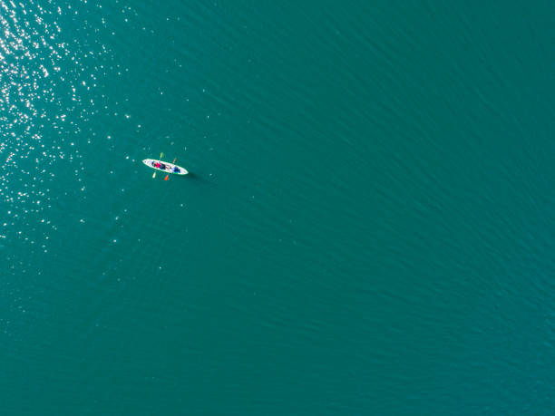 istock One kayak in the blue lake 878391028
