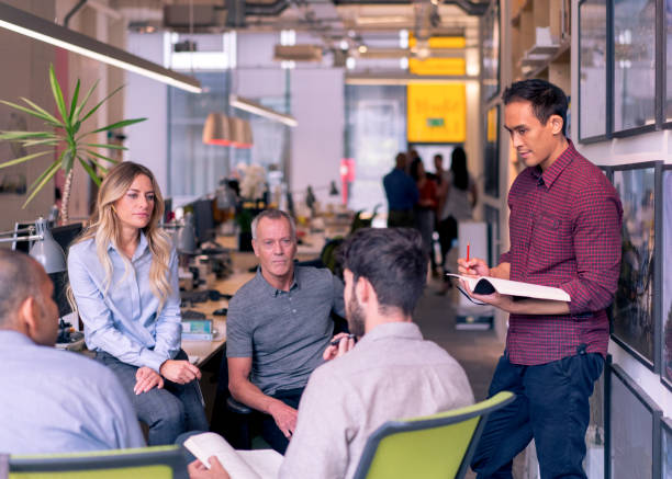 istock Business people discussing in creative office 878396078