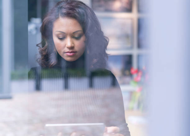 istock Businesswoman using digital tablet in office 878400932