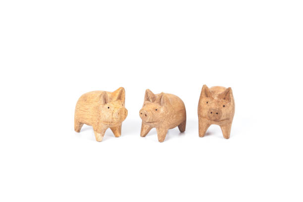 istock piggy wood toy on white background 878401786