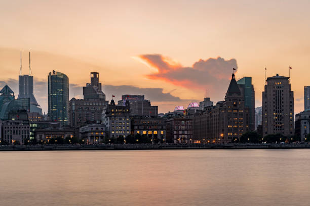 istock Shanghai skyline at sunset 878404558