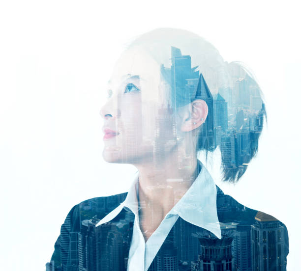 istock Multiple exposure of businesswoman looking up 878404936