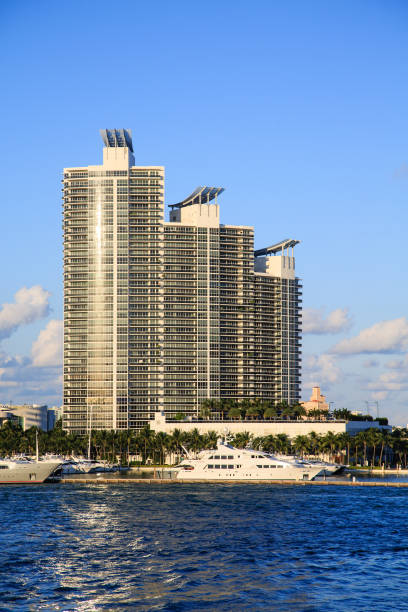 istock Yacht Docked at High Rise Condos 878405088