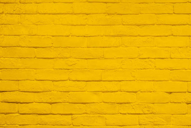 istock Yellow brick wall texture and background. 878405242