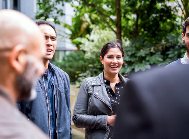 istock Business people discussing outside office 878405520