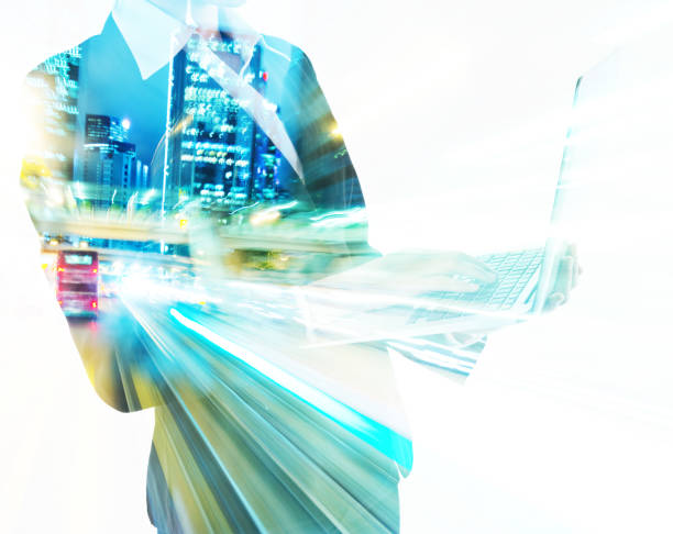istock Multiple exposure of businesswoman using laptop 878405892