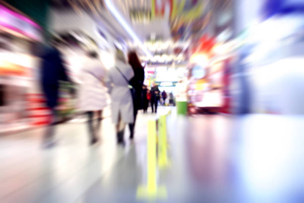 istock Walking people through the shopping center 878409270