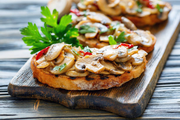 istock Ciabatta grilled with fried mushrooms and onions. 878409684