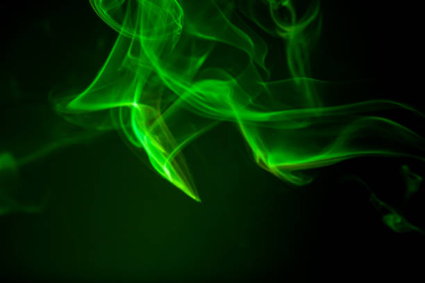 istock Green smoke motion on black background. 878410116