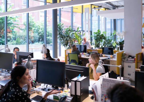 istock Multi-ethnic business people working in office 878418874