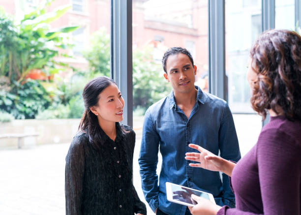 istock Business people communicating in office 878419728
