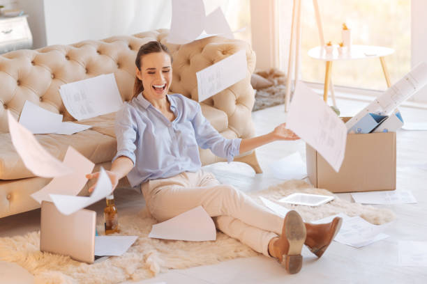 istock Emotional young woman celebrating her promotion at work 878422132
