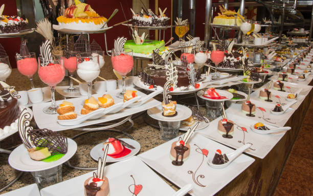 istock Selection of desserts on display at a restaurant buffet 878422826