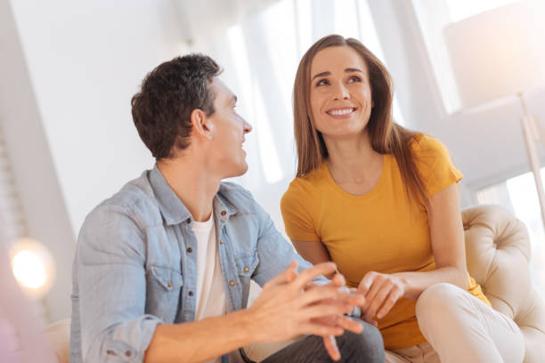 istock Cheerful loving people discussing their future and smiling 878426596