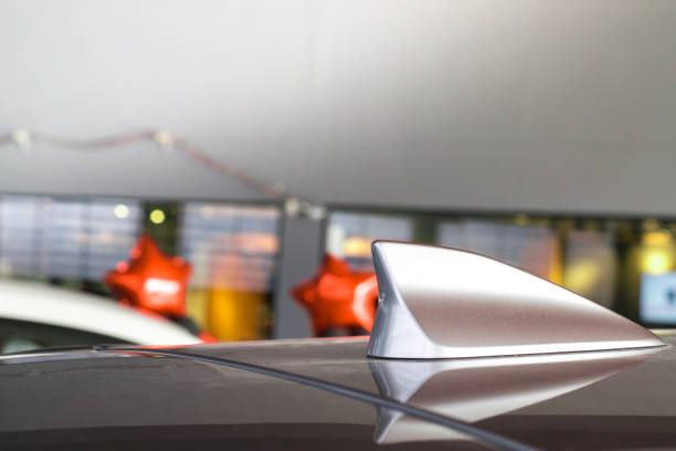 istock antenna shark fin white color on blurry backgorund. Using wallpaper or background.this car, automotive, transport image. 878426622