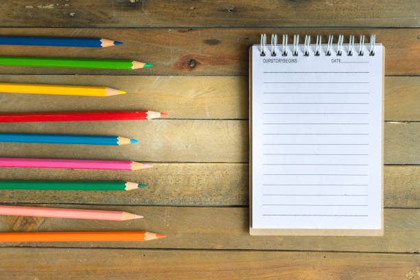 istock Notepad with pencil on wood board background.using wallpaper for education, business photo.Take note of the product for book with paper and concept, object or copy space. 878426748