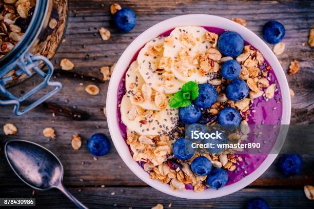 Healthy Smoothie Bowl With Granola Banana And Fresh Blueberries Stock Photo - Download Image Now