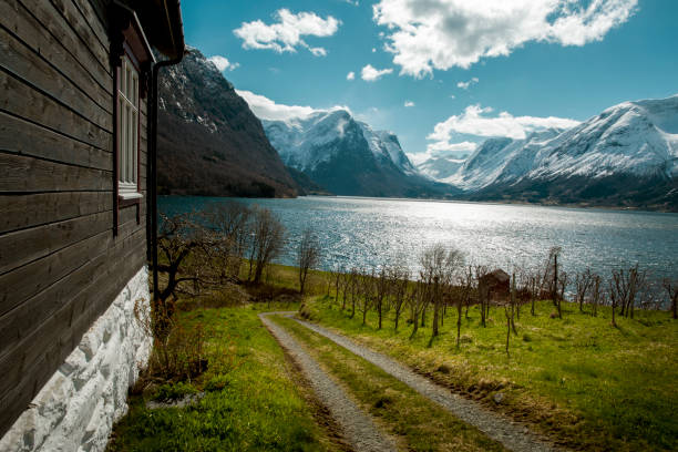 Log cabin in front of fjord by Loen in Norway.