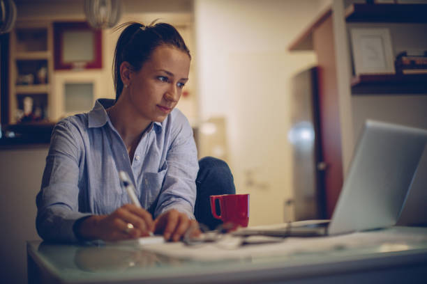 istock Brunette woman working from home 878443384