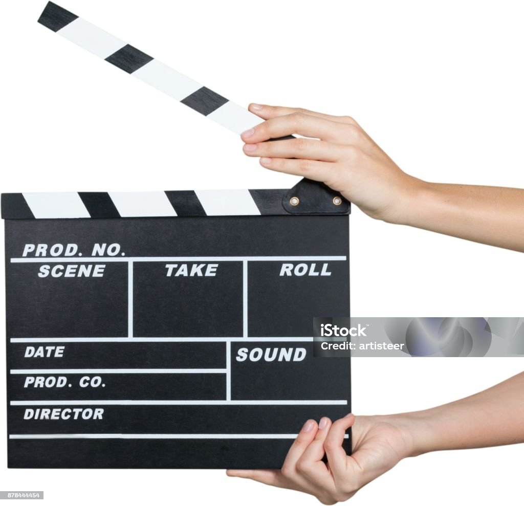 Film slate. Human Hands Holding a Movie Clapboard - Isolated Activity Stock Photo