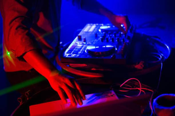 istock DJ stage mixing on stage party in nightclub 878446828