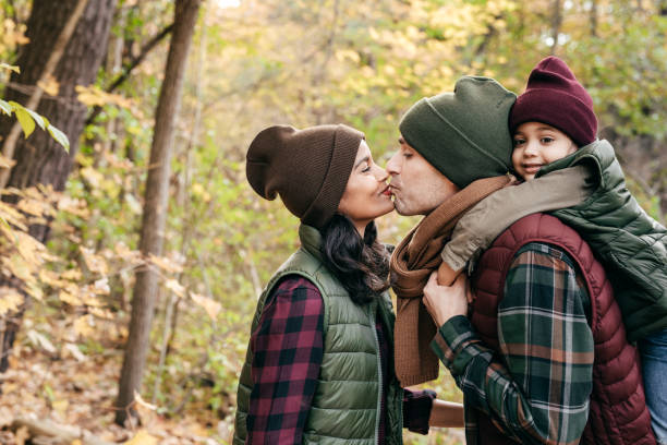 istock Parents and daughter in the park 878447246