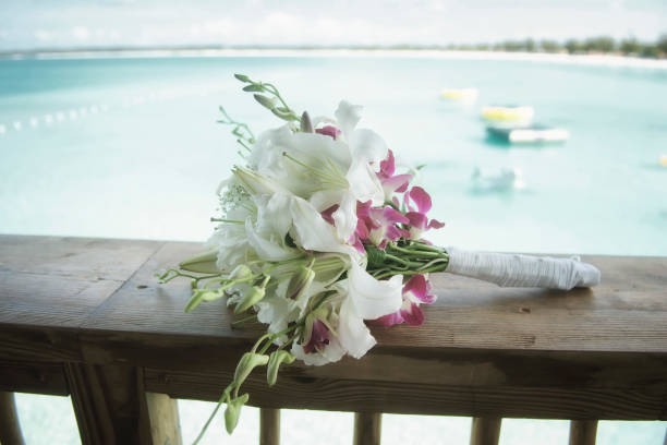 istock Bridal bouquet and beach view at the background 878457360