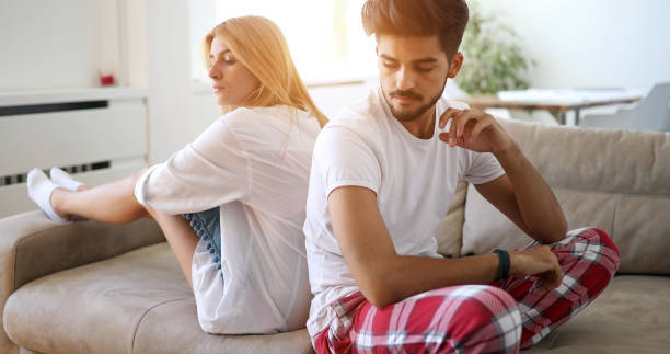 istock Unhappy couple having crisis and difficulties in relationship 878460184