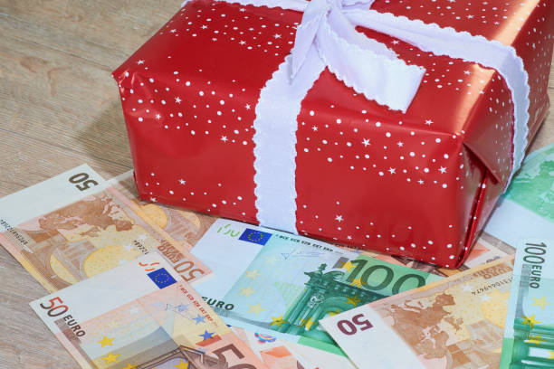 istock Christmas gifts with banknotes Euro 878461010