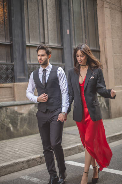istock Beautiful elegant couple on the street 878461164