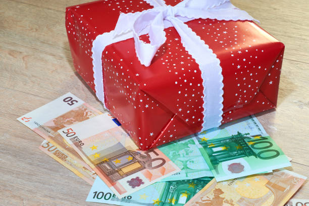 istock Christmas gifts with banknotes Euro 878461436