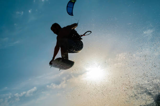 istock Surfer flying towards the sun 878464164