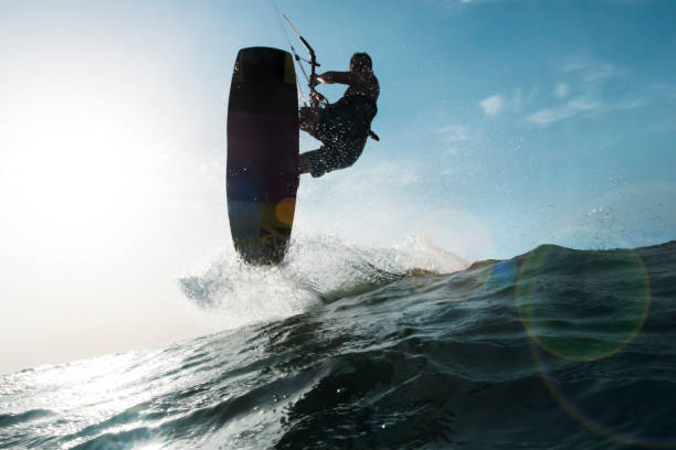 istock Surfer jumping a wave in front of the camera 878464186