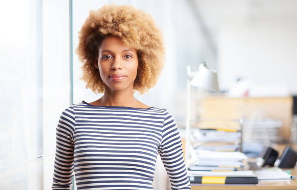 istock Businesswoman standing in the office 878467382