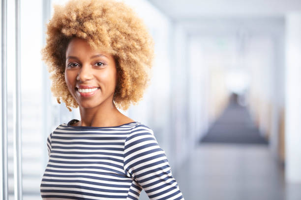 istock Smiling young professional woman 878467416