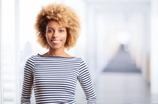 istock Happy young woman portrait 878467428