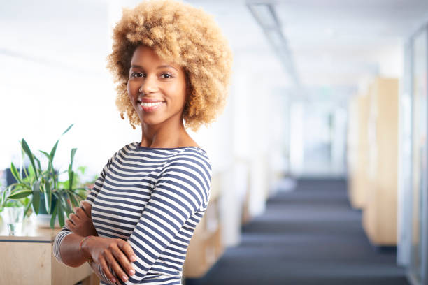istock Professional young woman in the office 878467664