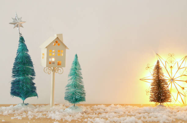 istock Image of christmas trees on snowy wooden table. 878471132