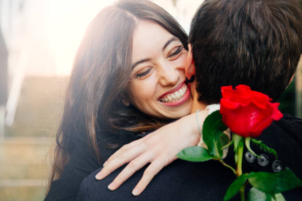 istock Happy couple in love with a rose 878474790