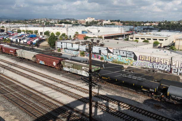 Industrial areas of Downtown Los Angeles Los Angeles, USA – 10 November 2015: The Los Angeles Downtown Industrial District is the central business district of Los Angeles, California, as well as a diverse residential neighborhood of some 58,000 people. View from now demolished 6th street bridge on Los Angeles river. sixth street bridge stock pictures, royalty-free photos & images