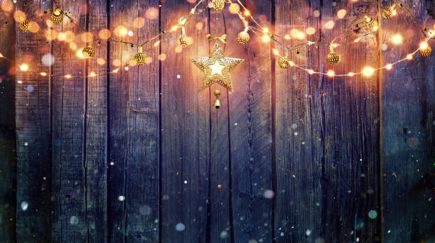 String Light Hanging At Vintage Wooden Background