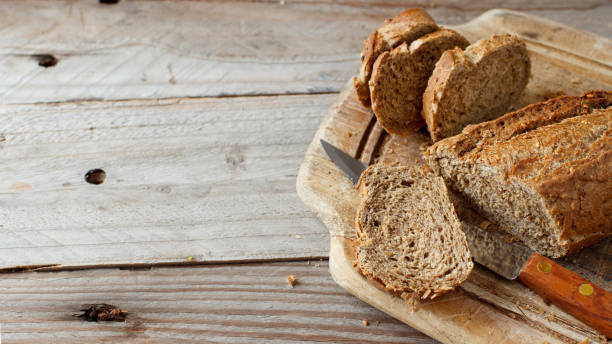 istock Wholemeal Bread on a Wooden Table 878481562
