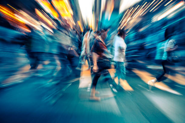 istock otion blurred crowd of people rushing through Hongkong 878493332