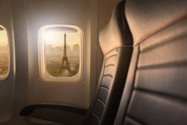 istock Window of airplane with sight to Eiffelturm in Paris 878494128