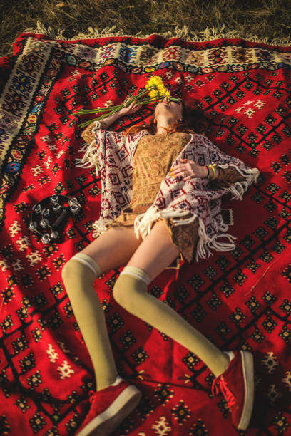 istock Hippie girl lying down on the rug 878494496