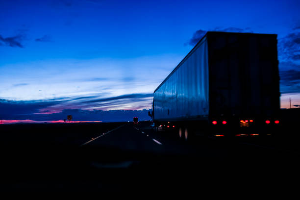 Large truck for shipping goods on a highway after sunset