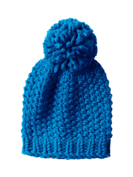 istock Blue woolen winter cap hat with a pom pom pompon isolated on white 878513194